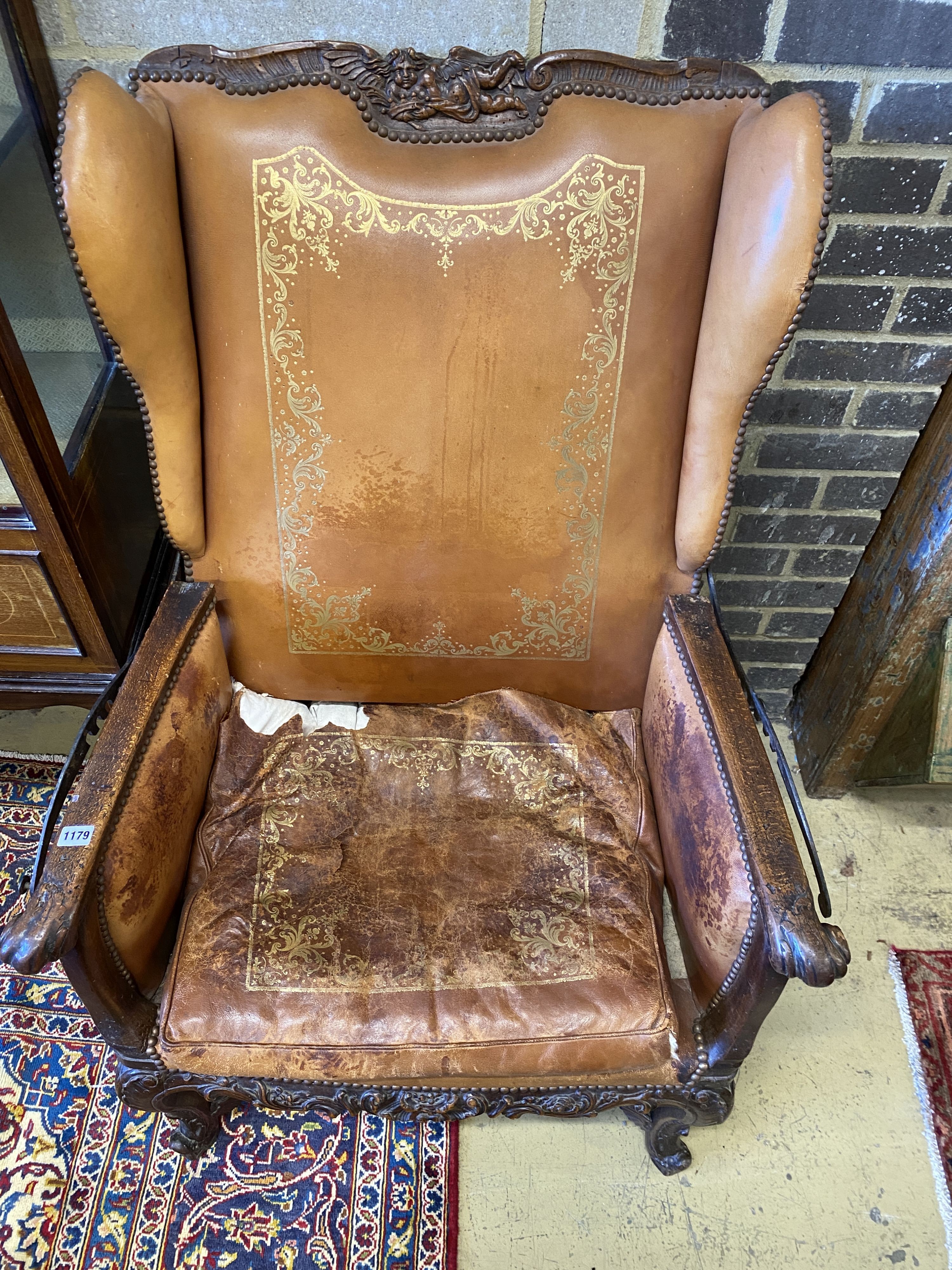 A 19th century French carved beech reclining armchair with original gilt leather upholstery, width 78cm, depth 74cm, height 114cm